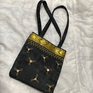 Unique small handbag with mirrors and gold trim